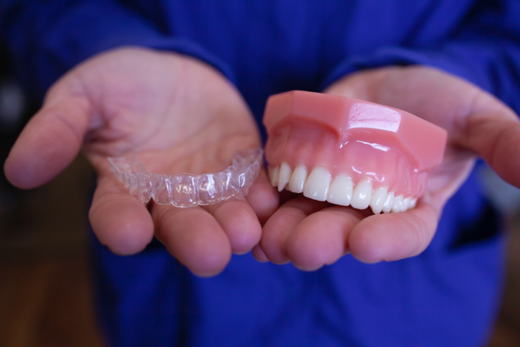 dentist holding invisalign mold