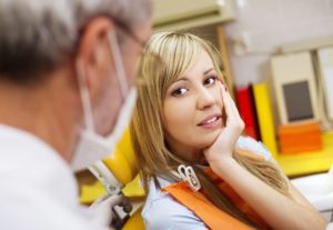 patient talking to dentist about teeth grinding