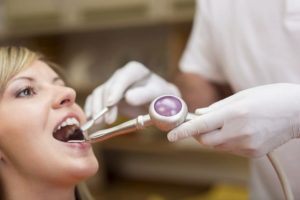 Dentist is treating patient with tooth infection