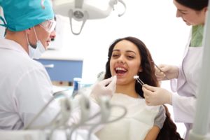 Pretty girl sitting at the dentist's and having dentist appointment