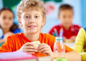 student with healthy school lunch